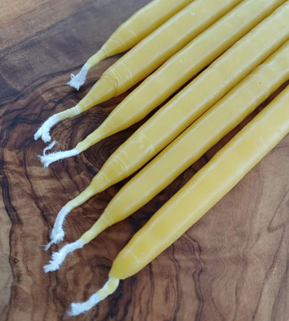 Hand dipped beeswax candles. Dimensions of candle 14 cm tall by 1 cm diameter. Burn time Up to 1 ½ hours