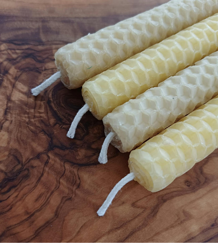 Hand rolled beeswax sheet candles. Dimensions of candle 13cm long by 1.5cm diameter. 1 to 2 hours burn time